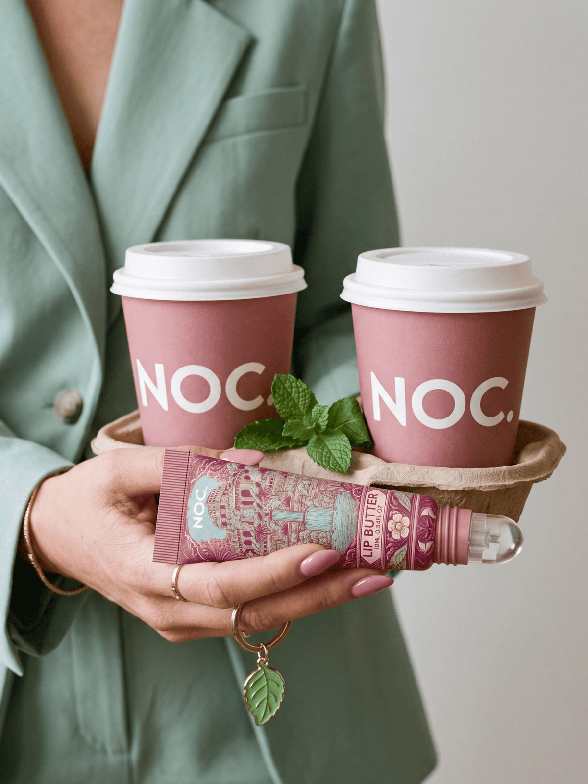 Lust Garden Lip Butter von NOC. Cosmetics in Rosé mit NOC. Kaffeebechern und Minze, getönter Lippenbalsam mit Minz-Aroma